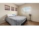 Comfortable bedroom featuring a window with natural light at 17423 W Yavapai St, Goodyear, AZ 85338