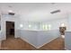 Spacious hallway featuring neutral paint, carpeted floor and natural light at 17423 W Yavapai St, Goodyear, AZ 85338