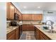 Well-equipped kitchen featuring granite countertops, stainless steel appliances, and tile backsplash at 17423 W Yavapai St, Goodyear, AZ 85338