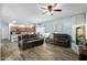 Spacious living room featuring wood tile flooring and two comfortable couches at 17423 W Yavapai St, Goodyear, AZ 85338