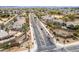 Scenic street view featuring palm trees, landscaping, and clear road markings in a residential area at 17423 W Yavapai St, Goodyear, AZ 85338