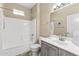 Bright bathroom features a shower-tub combo, vanity, and white porcelain toilet at 17882 N Painted Spurge Ct, Surprise, AZ 85374