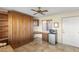 Bedroom featuring a built in cabinet/bed, desk and shelving area with a mini fridge at 17882 N Painted Spurge Ct, Surprise, AZ 85374