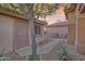 Charming front courtyard with stone landscaping and seating area, and a secure front door at 17882 N Painted Spurge Ct, Surprise, AZ 85374