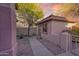 Charming side yard with stone landscaping and a small tree at 17882 N Painted Spurge Ct, Surprise, AZ 85374