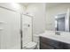 This bathroom features a glass shower, a toilet, a light-colored vanity, and natural light at 1881 S 223Rd Dr, Buckeye, AZ 85326