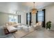 Bright living room featuring modern furnishings, natural light, and neutral color palette at 1881 S 223Rd Dr, Buckeye, AZ 85326