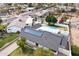 Aerial view of a home with solar panels, a backyard pool, and a spacious lawn at 1908 N 47Th St, Phoenix, AZ 85008