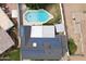 Aerial view of a home highlighting the pool and solar panels in a suburban setting at 1908 N 47Th St, Phoenix, AZ 85008