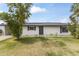 Inviting single-story home with a green lawn, solar panels, and a freshly painted exterior at 1908 N 47Th St, Phoenix, AZ 85008