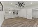 Open-concept kitchen with stainless steel appliances and an island, connecting to a spacious living area at 1908 N 47Th St, Phoenix, AZ 85008