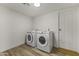 Convenient laundry room with modern washer and dryer, and a clean, functional layout at 1908 N 47Th St, Phoenix, AZ 85008