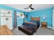 Bright bedroom with blue walls, natural light, a comfortable bed, and ample storage space at 2065 E Alameda Dr, Tempe, AZ 85282