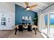 Inviting dining room featuring a wooden table, stylish chairs, and a modern ceiling fan, perfect for gatherings at 2065 E Alameda Dr, Tempe, AZ 85282