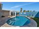 Inviting pool area featuring a sparkling pool, a stone firepit, and a covered patio, perfect for relaxing and entertaining at 2065 E Alameda Dr, Tempe, AZ 85282