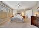 Spacious bedroom with carpet flooring and a view into the en suite bathroom at 20802 N Grayhawk Dr # 1017, Scottsdale, AZ 85255