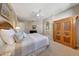 Serene bedroom with decorative armoire and en suite bathroom at 20802 N Grayhawk Dr # 1017, Scottsdale, AZ 85255