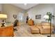 Comfortable bedroom featuring desk, sitting area, and wood-look flooring at 20802 N Grayhawk Dr # 1017, Scottsdale, AZ 85255