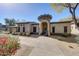 Charming stucco home with a turret-style entrance and meticulously landscaped front yard at 20802 N Grayhawk Dr # 1017, Scottsdale, AZ 85255