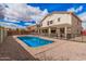 Inviting backyard with a sparkling in-ground pool, perfect for outdoor entertaining and relaxation at 21 W Red Mesa Trl, San Tan Valley, AZ 85143