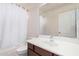 Bright bathroom with a modern sink, vanity, and shower with curtain at 21 W Red Mesa Trl, San Tan Valley, AZ 85143