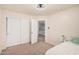 Cozy bedroom featuring a large closet, a ceiling fan, and neutral carpeting at 21 W Red Mesa Trl, San Tan Valley, AZ 85143