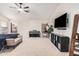 Large primary bedroom featuring a ceiling fan, tv, and neutral carpeting at 21 W Red Mesa Trl, San Tan Valley, AZ 85143