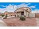 Charming home with a two-car garage and welcoming porch, complemented by desert landscaping at 21 W Red Mesa Trl, San Tan Valley, AZ 85143