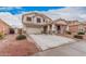 Charming two-story home with a two-car garage and a welcoming front porch, complemented by a well-maintained yard at 21 W Red Mesa Trl, San Tan Valley, AZ 85143