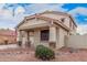 Charming home with a two-car garage and welcoming porch, complemented by desert landscaping at 21 W Red Mesa Trl, San Tan Valley, AZ 85143