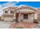 Charming two-story home with a two-car garage and a welcoming front porch, complemented by a well-maintained yard at 21 W Red Mesa Trl, San Tan Valley, AZ 85143