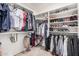 Spacious walk-in closet featuring shelving and hanging rods at 21 W Red Mesa Trl, San Tan Valley, AZ 85143