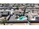 Aerial view of the property showcasing the backyard pool, gazebo, well-maintained landscaping, and surrounding neighborhood at 2110 W Pampa Ave, Mesa, AZ 85202