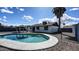 Inviting backyard featuring a sparkling pool, gazebo, and lush palm tree, perfect for outdoor relaxation and entertaining at 2110 W Pampa Ave, Mesa, AZ 85202