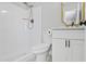 Bathroom with shower, toilet, and white vanity with gold-colored fixtures at 2110 W Pampa Ave, Mesa, AZ 85202