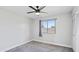 Bright bedroom featuring carpet, a ceiling fan, and a closet with white doors at 2110 W Pampa Ave, Mesa, AZ 85202