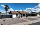 Charming front exterior showcasing well-maintained landscaping, a covered porch, and a welcoming entrance to the home at 2110 W Pampa Ave, Mesa, AZ 85202