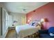 Cozy bedroom with a plush bed, stylish lamps, and a view to the en-suite bath at 2201 N Central Ave # 11A, Phoenix, AZ 85004