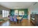 Traditional dining room with a wooden table, colorful chairs, and decorative lighting at 2201 N Central Ave # 11A, Phoenix, AZ 85004