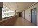 Hallway entrance with elevator access featuring brick details and potted plants at 2201 N Central Ave # 11A, Phoenix, AZ 85004