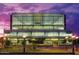 Exterior view of the library building at dusk, showcasing its modern architectural design and surrounding landscape at 2201 N Central Ave # 11A, Phoenix, AZ 85004