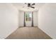 A well-lit bedroom featuring a ceiling fan and a window with curtains allowing plenty of natural light at 22624 S 224Th Pl, Queen Creek, AZ 85142