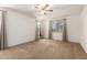Bedroom with plush carpet, ceiling fan and windows with natural light at 22624 S 224Th Pl, Queen Creek, AZ 85142