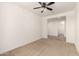 Neutral bedroom with ceiling fan, carpet, and doorway, offering a comfortable and versatile space at 22624 S 224Th Pl, Queen Creek, AZ 85142