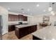 Well-lit kitchen with island and views into the dining area at 22624 S 224Th Pl, Queen Creek, AZ 85142