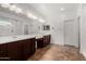 Beautifully appointed main bathroom with dual vanities, a large mirror, and tile flooring at 22624 S 224Th Pl, Queen Creek, AZ 85142