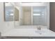 Bright bathroom with a spacious countertop, modern fixtures, and a large mirror at 23276 W Cocopah St, Buckeye, AZ 85326