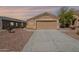 Charming single-story home with a well-manicured yard and a two-car garage at 23276 W Cocopah St, Buckeye, AZ 85326