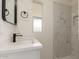 A beautifully renovated bathroom featuring a white vanity, modern fixtures, and a tiled shower at 241 S 54Th St, Mesa, AZ 85206