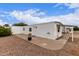 Exterior of a home with low maintenance landscaping and covered entry at 241 S 54Th St, Mesa, AZ 85206